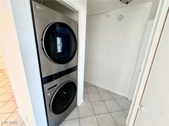 2064 Mesquite Ln Unit 102, Laughlin, NV 89029 - laundry area featuring stacked washer / drying machine and light tile patterned flooring