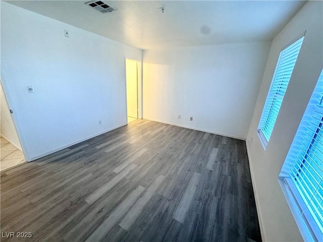 2064 Mesquite Ln Unit 102, Laughlin, NV 89029 - empty room with dark wood-style flooring and baseboards