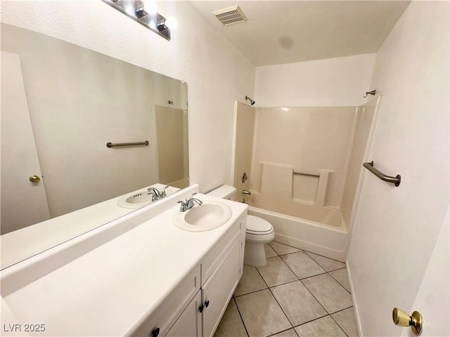 2064 Mesquite Ln Unit 102, Laughlin, NV 89029 - bathroom with toilet, vanity, tile patterned floors, and  shower combination