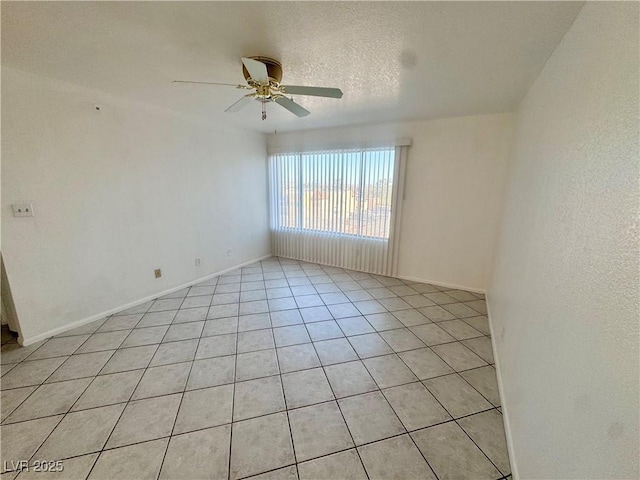 2064 Mesquite Ln Unit 102, Laughlin, NV 89029 - spare room with light tile patterned flooring, ceiling fan, and baseboards