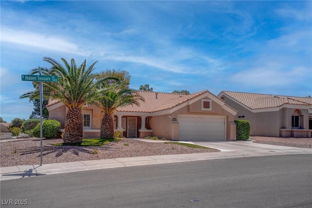 3040 Hidden Treasure Dr, Las Vegas, NV 89134 - view of front of house featuring a garage, stucco siding, concrete driveway, and a tile roof