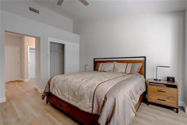 3040 Hidden Treasure Dr, Las Vegas, NV 89134 - bedroom featuring light wood finished floors, a closet, baseboards, and vaulted ceiling