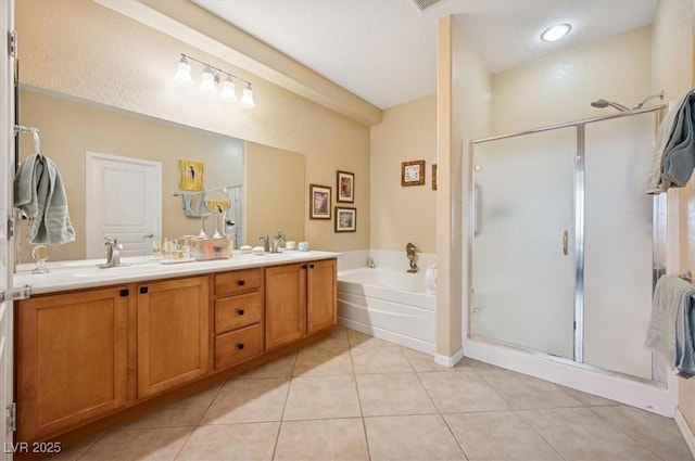 2453 Vivid Sky Pl, Henderson, NV 89044 - full bathroom featuring a bath, a shower stall, double vanity, and tile patterned floors