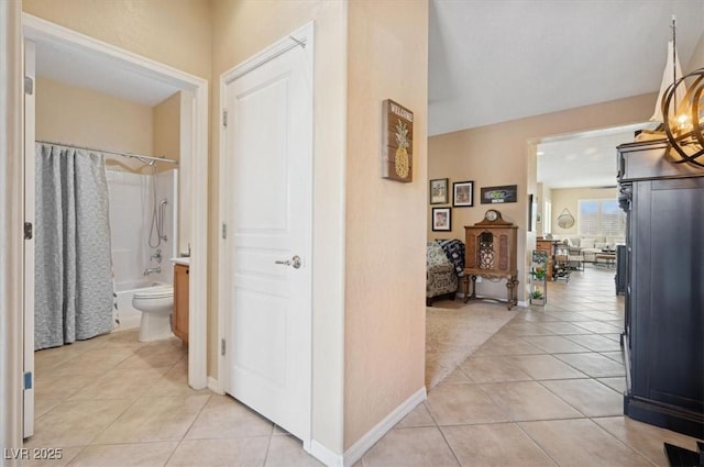 2453 Vivid Sky Pl, Henderson, NV 89044 - corridor featuring light tile patterned floors and baseboards