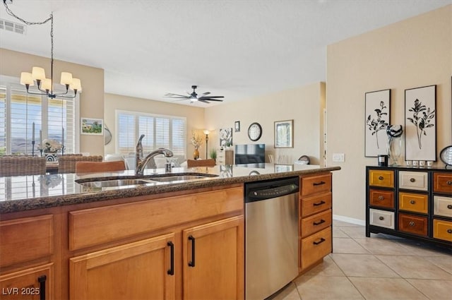 2453 Vivid Sky Pl, Henderson, NV 89044 - kitchen featuring stainless steel dishwasher, a sink, dark stone counters, a ceiling fan, and open floor plan