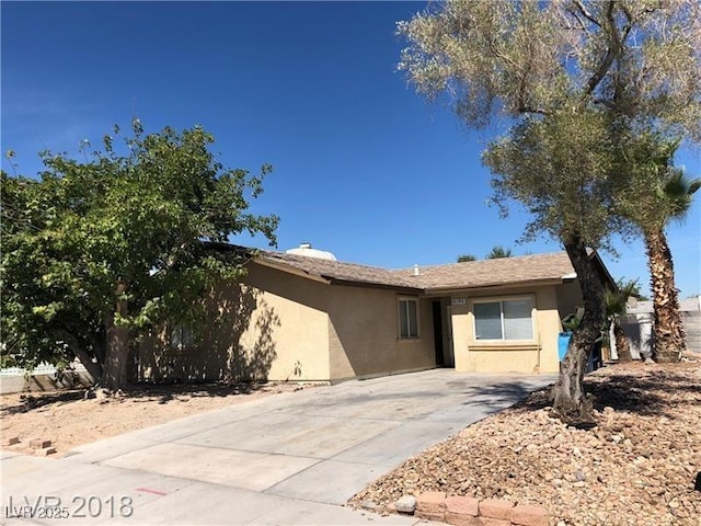 6196 W University Ave, Las Vegas, NV 89103 - view of front of property featuring stucco siding and driveway