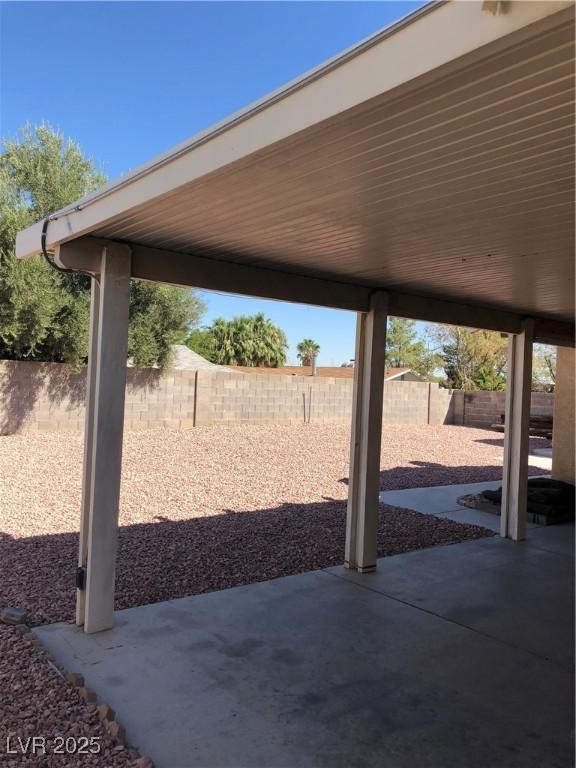 6196 W University Ave, Las Vegas, NV 89103 - fenced backyard with a patio