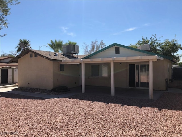 6196 W University Ave, Las Vegas, NV 89103 - back of house featuring a patio area, central AC unit, and stucco siding