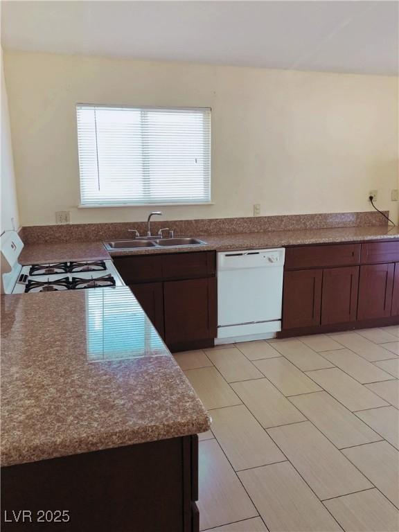 6196 W University Ave, Las Vegas, NV 89103 - kitchen featuring white appliances and a sink