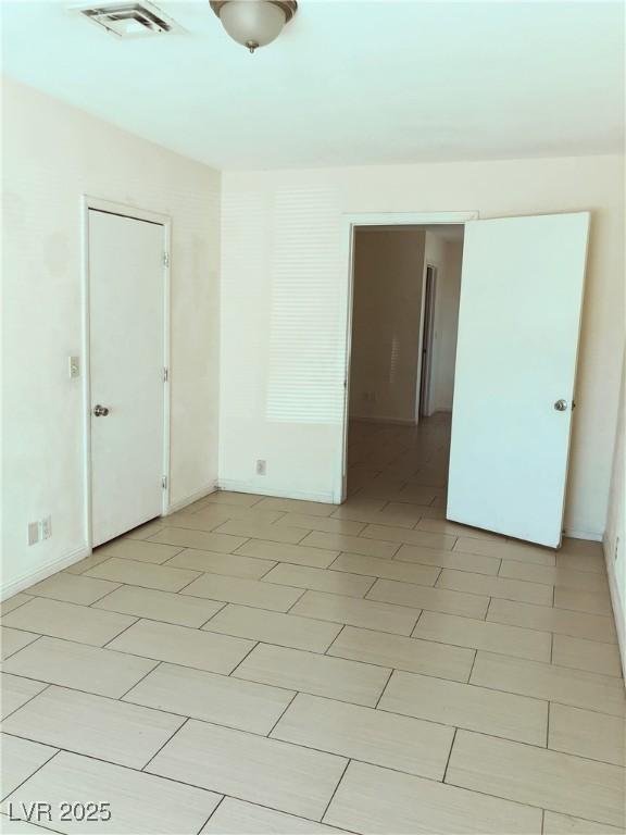 6196 W University Ave, Las Vegas, NV 89103 - spare room featuring baseboards