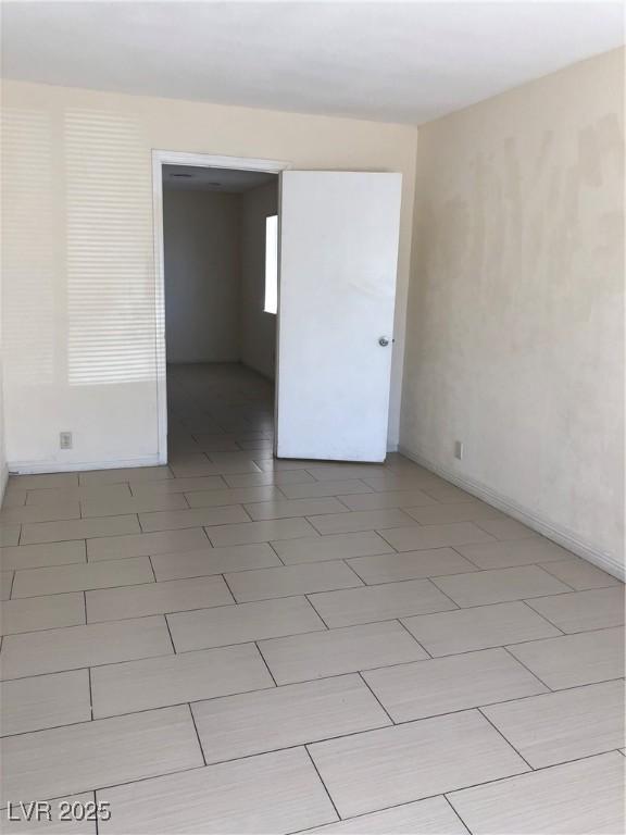 6196 W University Ave, Las Vegas, NV 89103 - spare room with baseboards