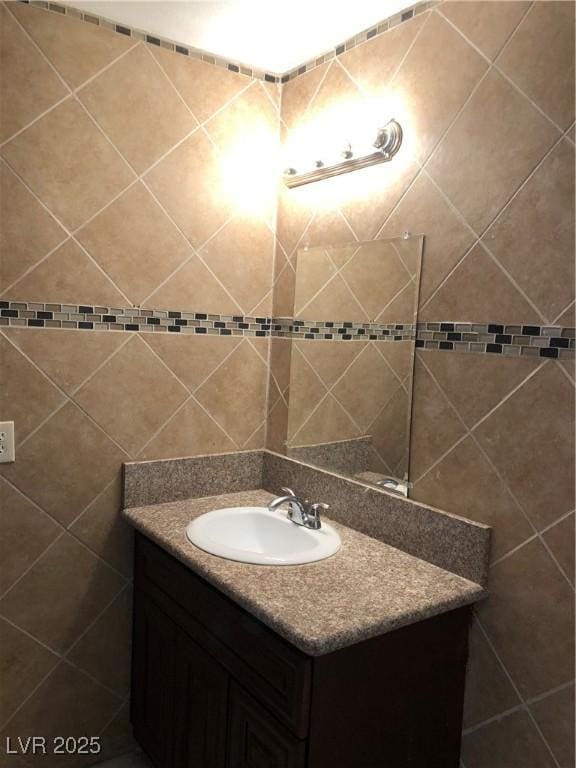 6196 W University Ave, Las Vegas, NV 89103 - bathroom featuring vanity and tile walls
