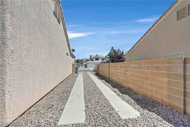6125 Desert Haven Rd, Las Vegas, NV 89130 - view of side of property featuring a fenced backyard and stucco siding