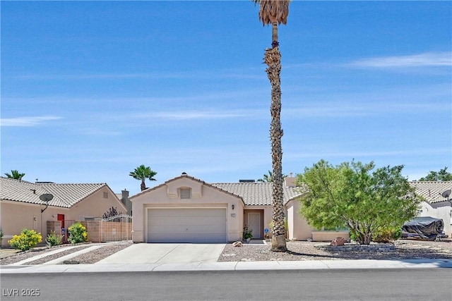6125 Desert Haven Rd, Las Vegas, NV 89130 - view of front of home featuring an attached garage, driveway, stucco siding, and a tile roof