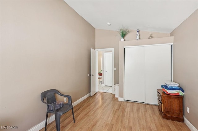 628 Bay Bridge Dr, North Las Vegas, NV 89032 - unfurnished bedroom featuring light wood-style floors, baseboards, lofted ceiling, and a closet