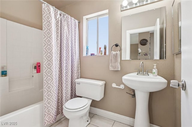 628 Bay Bridge Dr, North Las Vegas, NV 89032 - full bathroom with toilet, shower / bathtub combination with curtain, tile patterned floors, and baseboards
