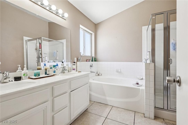 628 Bay Bridge Dr, North Las Vegas, NV 89032 - bathroom featuring a stall shower, a garden tub, double vanity, and tile patterned flooring