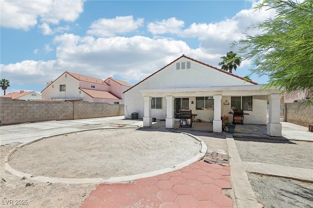 628 Bay Bridge Dr, North Las Vegas, NV 89032 - rear view of house featuring a patio, a fenced backyard, and stucco siding