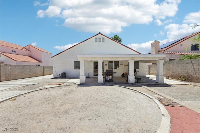 628 Bay Bridge Dr, North Las Vegas, NV 89032 - rear view of property with a patio area, a fenced backyard, and stucco siding