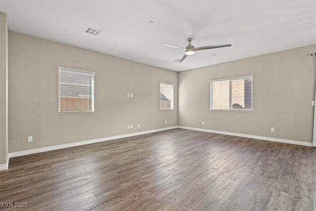 7051 Denio Island St, North Las Vegas, NV 89084 - spare room featuring a ceiling fan, wood finished floors, and baseboards