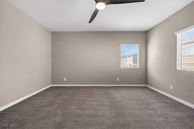 7051 Denio Island St, North Las Vegas, NV 89084 - empty room featuring a ceiling fan, dark carpet, and baseboards