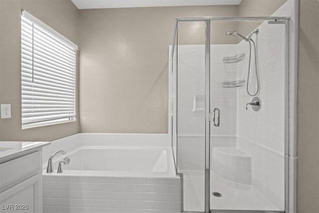 7051 Denio Island St, North Las Vegas, NV 89084 - bathroom featuring a garden tub, a shower stall, and vanity