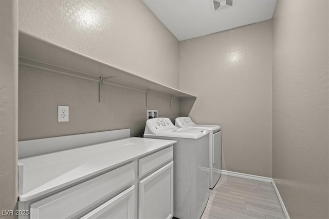 7051 Denio Island St, North Las Vegas, NV 89084 - washroom featuring washer and dryer, baseboards, and cabinet space