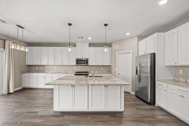 7051 Denio Island St, North Las Vegas, NV 89084 - kitchen with stainless steel appliances, recessed lighting, white cabinetry, and dark wood-type flooring