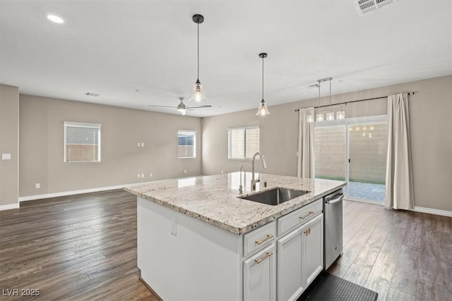 7051 Denio Island St, North Las Vegas, NV 89084 - kitchen with a sink, stainless steel dishwasher, dark wood finished floors, baseboards, and recessed lighting