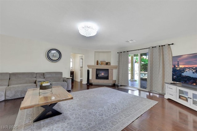 8224 Fawn Meadow Ave, Las Vegas, NV 89149 - living area with a tiled fireplace and dark wood finished floors