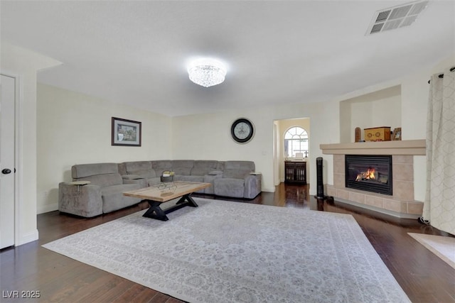 8224 Fawn Meadow Ave, Las Vegas, NV 89149 - living area featuring wood finished floors, a tile fireplace, and baseboards