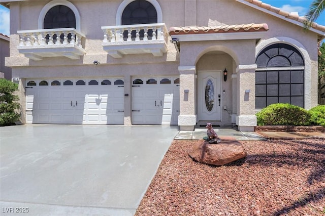 8224 Fawn Meadow Ave, Las Vegas, NV 89149 - mediterranean / spanish house with a balcony, stucco siding, a garage, and driveway