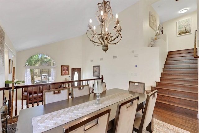 8224 Fawn Meadow Ave, Las Vegas, NV 89149 - dining space featuring a chandelier, stairway, and high vaulted ceiling