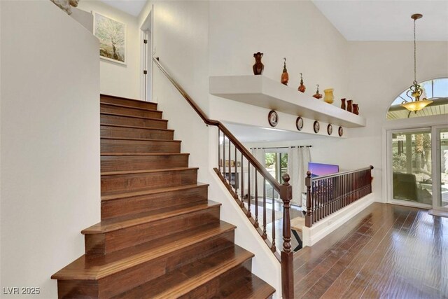 8224 Fawn Meadow Ave, Las Vegas, NV 89149 - stairs featuring wood finished floors