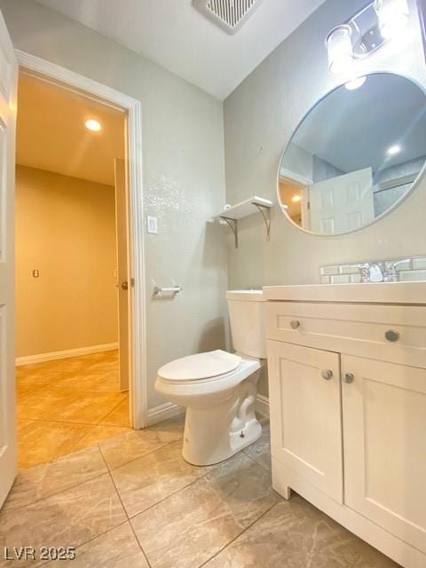 6315 Eldora Ave, Las Vegas, NV 89146 - bathroom with vanity, toilet, and tile patterned floors