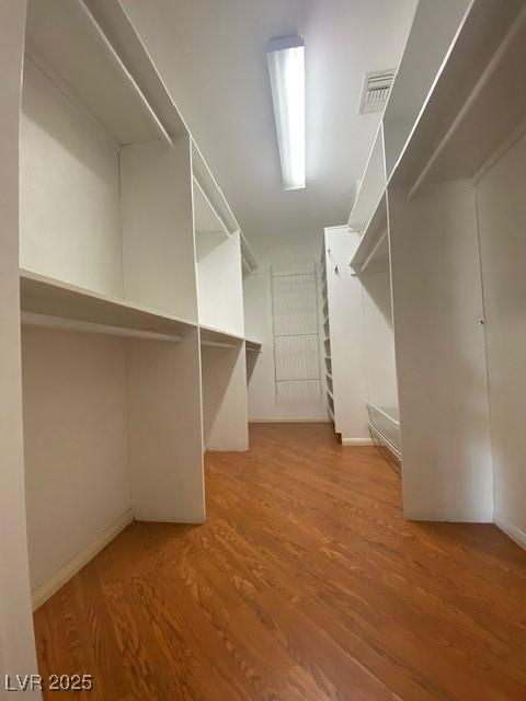 6315 Eldora Ave, Las Vegas, NV 89146 - spacious closet with wood finished floors