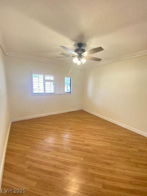 6315 Eldora Ave, Las Vegas, NV 89146 - empty room with crown molding, light wood-style floors, ceiling fan, and baseboards