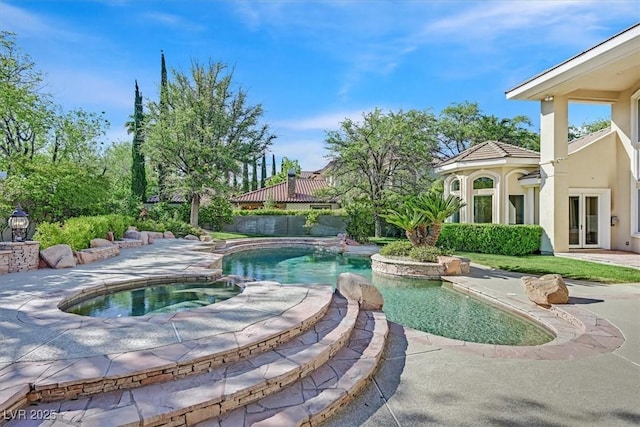1809 White Hawk Ct, Las Vegas, NV 89134 - view of swimming pool with french doors, a pool with connected hot tub, and a patio area