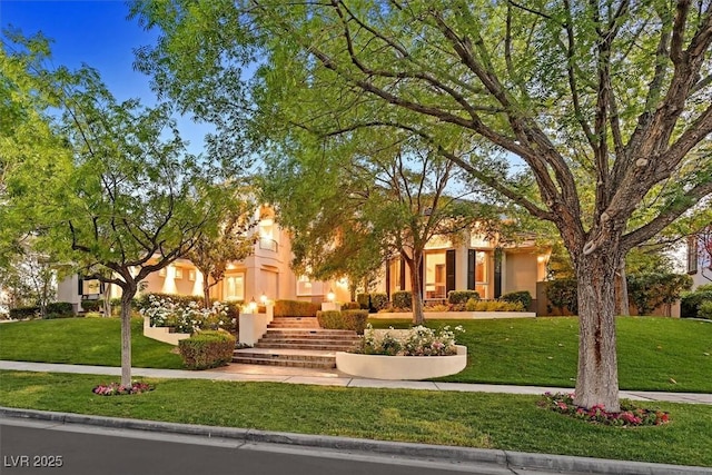 1809 White Hawk Ct, Las Vegas, NV 89134 - view of property hidden behind natural elements with a front lawn and stucco siding