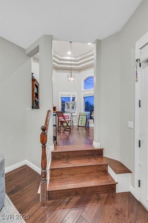 1809 White Hawk Ct, Las Vegas, NV 89134 - stairs featuring wood finished floors, baseboards, a raised ceiling, and recessed lighting