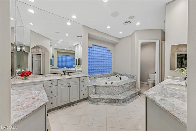 1809 White Hawk Ct, Las Vegas, NV 89134 - bathroom with vanity, toilet, a bath, tile patterned flooring, and recessed lighting