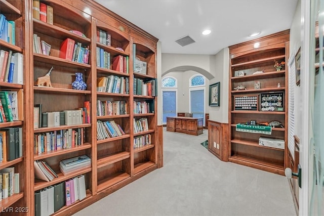 1809 White Hawk Ct, Las Vegas, NV 89134 - sitting room featuring arched walkways, carpet, bookshelves, and recessed lighting