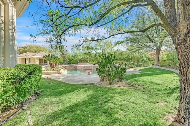 1809 White Hawk Ct, Las Vegas, NV 89134 - view of green lawn featuring a patio and an outdoor pool