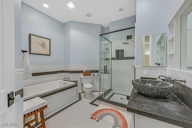 1809 White Hawk Ct, Las Vegas, NV 89134 - full bath with toilet, a stall shower, vanity, a garden tub, and tile patterned flooring