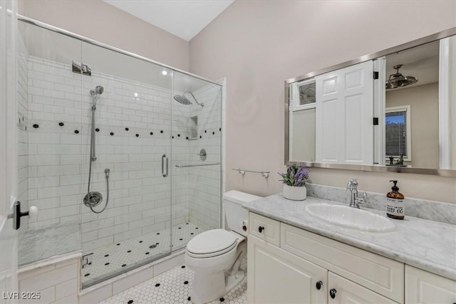 1809 White Hawk Ct, Las Vegas, NV 89134 - bathroom with a stall shower, vanity, toilet, and tile patterned flooring
