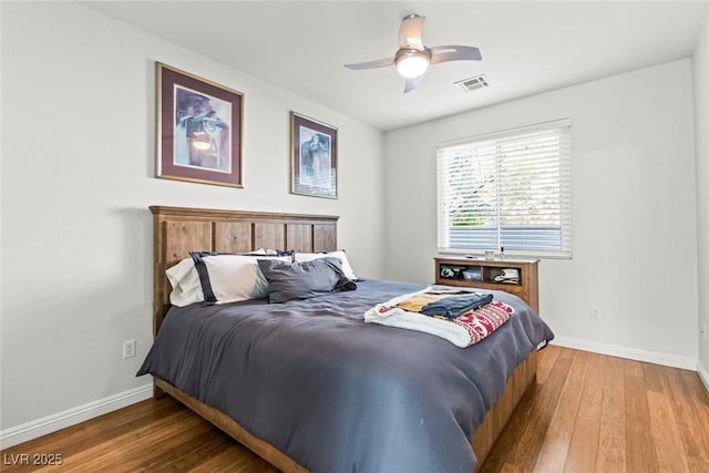 9301 Queen Charlotte Dr, Las Vegas, NV 89145 - bedroom featuring wood-type flooring, baseboards, and a ceiling fan