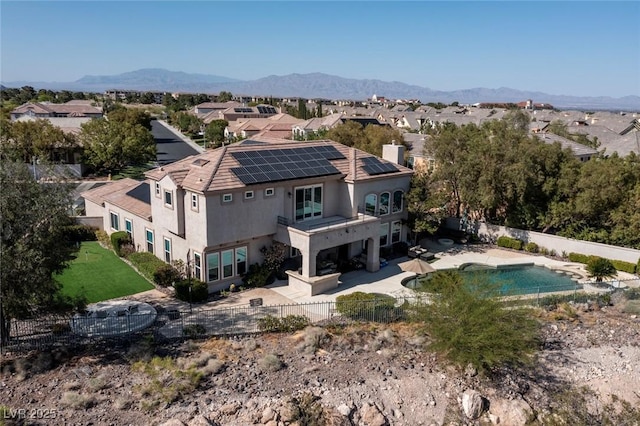 9301 Queen Charlotte Dr, Las Vegas, NV 89145 - rear view of house with solar panels, a fenced backyard, a patio, and stucco siding