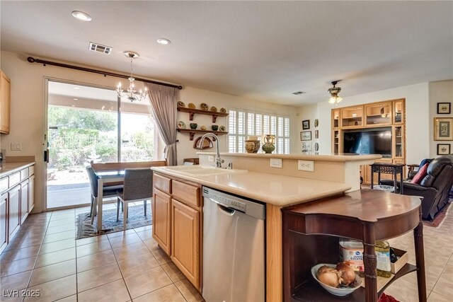 10361 Profeta Ct, Las Vegas, NV 89135 - kitchen featuring dishwasher, a sink, open floor plan, light tile patterned floors, and light countertops
