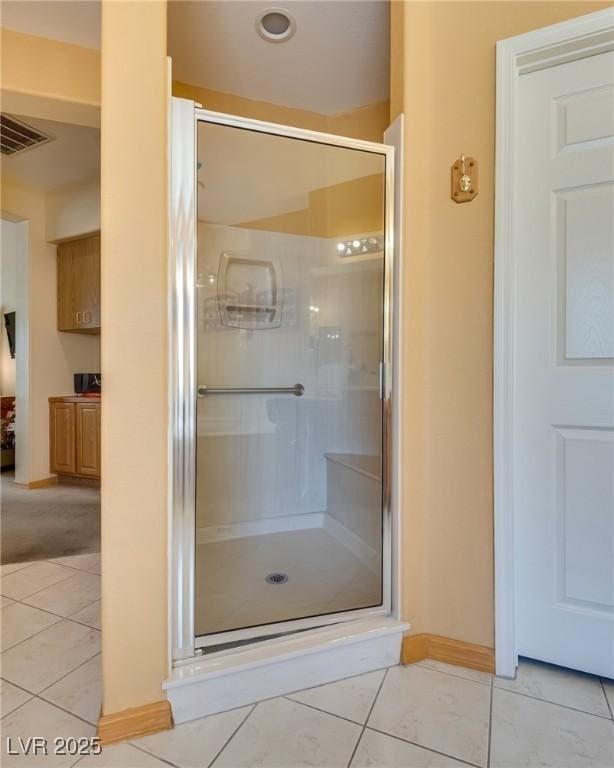 10361 Profeta Ct, Las Vegas, NV 89135 - bathroom featuring a shower stall, tile patterned flooring, and baseboards