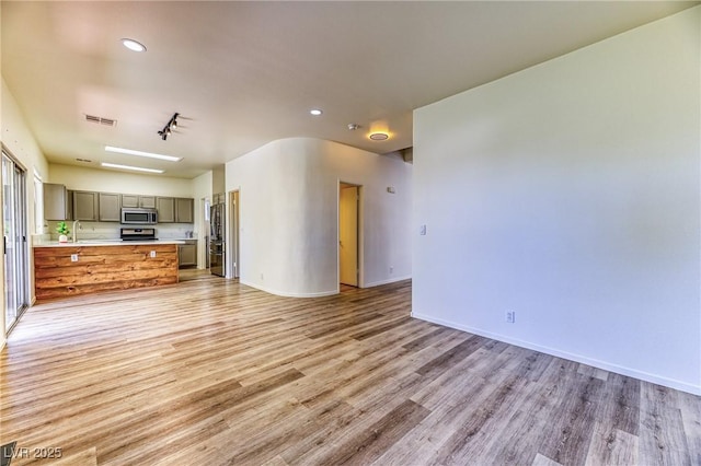 7900 Dutch Canyon Ct, Las Vegas, NV 89131 - unfurnished living room with light wood finished floors and recessed lighting